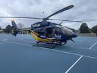 A man in his 50s was transported by CareFlight to Royal North Shore Hospital after being caught in powerlines while kitesurfing.
