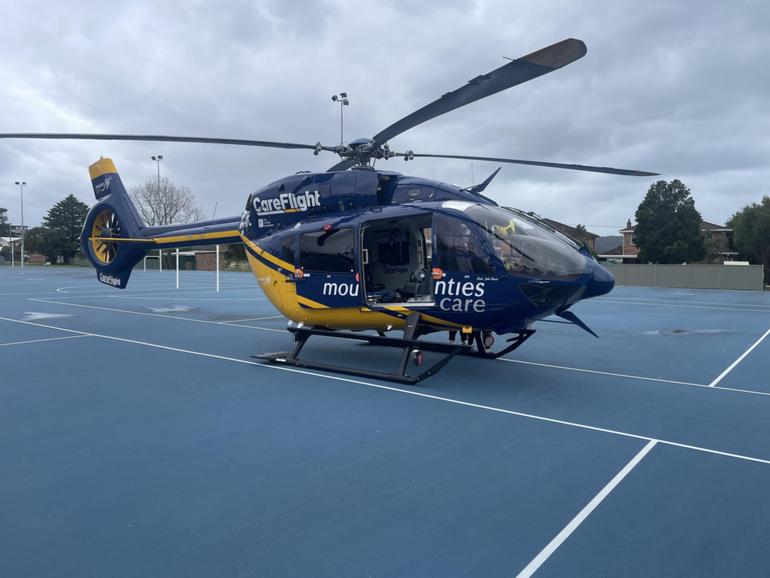 A man in his 50s was transported by CareFlight to Royal North Shore Hospital after being caught in powerlines while kitesurfing.