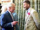 David Beckham wearing a David Austin Roses ‘King's Rose’ speaks with King Charles III.
