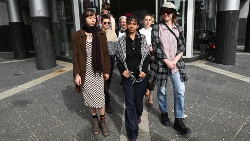 Aahana Nag (centre) has been sentenced to community service for vandalising Peter Dutton's office.