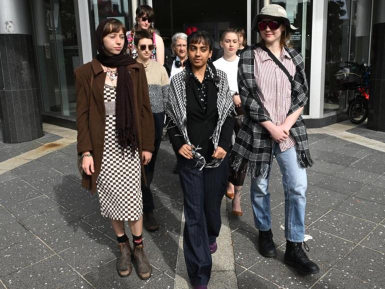 Aahana Nag (centre) has been sentenced to community service for vandalising Peter Dutton's office.