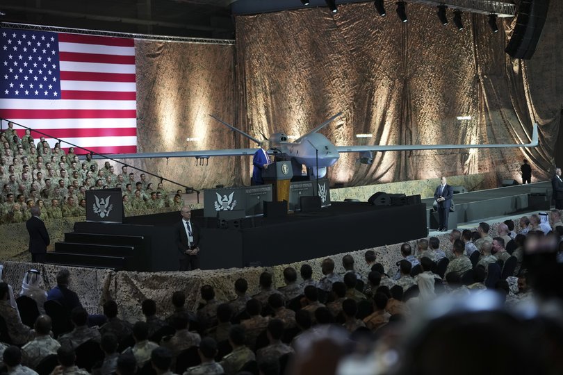 President Donald Trump speaks to troops at Al Udeid Air Base, the largest American military facility in the region, in Doha, Qatar, May 15, 2025.