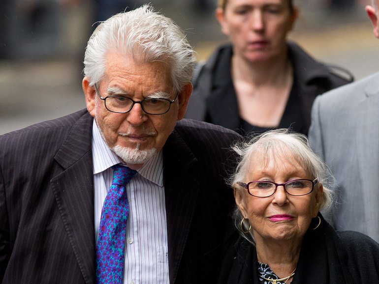 Rolf Harris arrives at Southwark Crown Court with his wife Alwen Hughes in 2014.