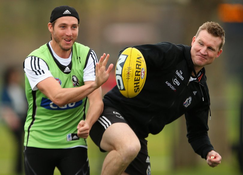 Nathan Buckley with Dale Thomas in 2012 when they were coach and player together at Collingwood.