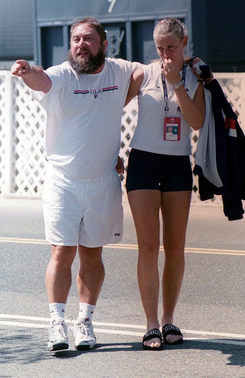 Upset tennis player Jelena Dokic with her father Damir after he got into a dispute with officials during the US Open.