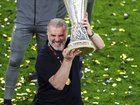 Spurs boss Ange Postecoglou lifts the Europa League trophy after they downed Manchester United.