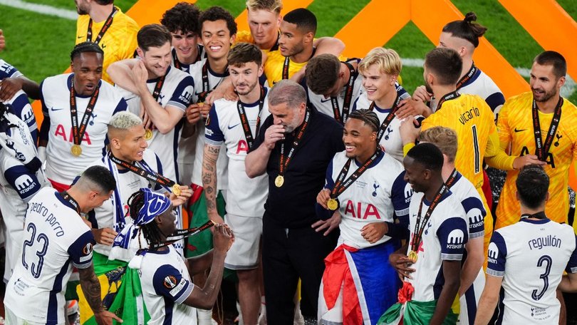 Postecoglou was then embraced by the team in the middle.