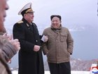  North Korean leader Kim Jong Un, right, stands with a North Korean navy commander.