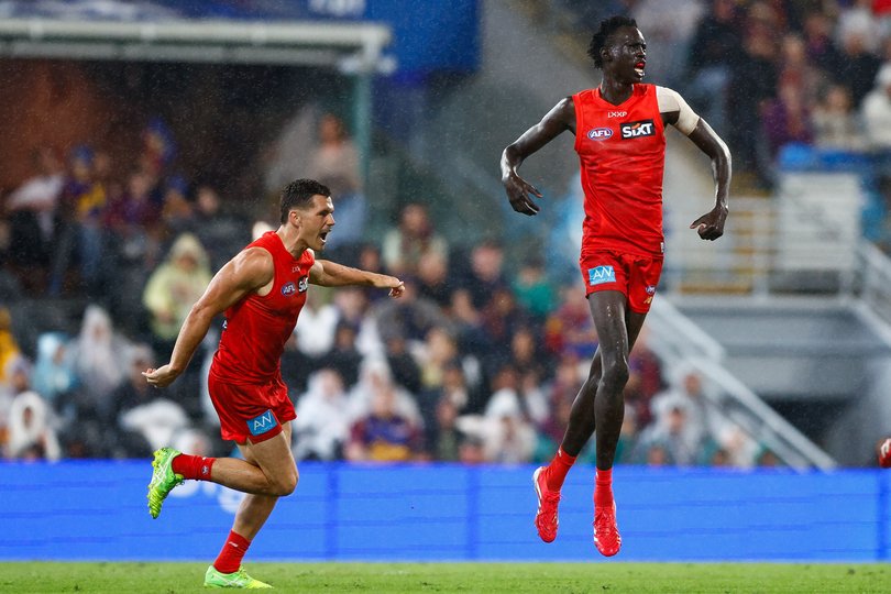Mac Andrew of the Suns celebrates a goal against the Lions.
