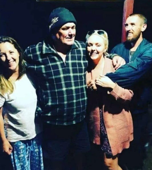 David Knowles, pictured with his three children, is one of four victims of major flooding in NSW.