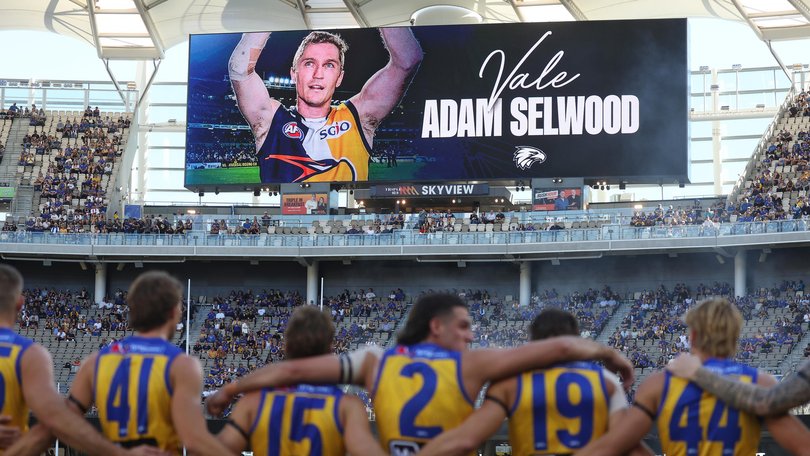 West Coast Eagles wear black armbands and pay tribute to 2006 premiership player Adam Selwood.