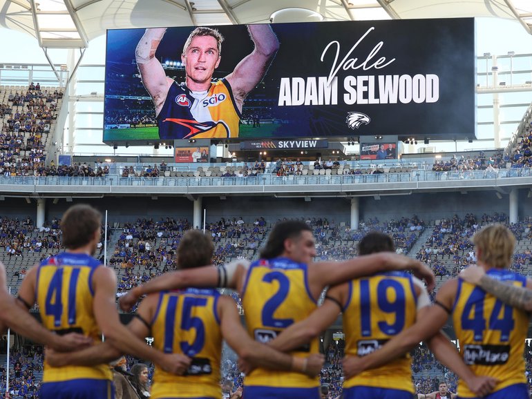 West Coast Eagles wear black armbands and pay tribute to 2006 premiership player Adam Selwood.