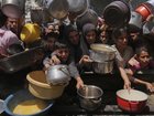 At least six Palestinians guarding aid trucks were killed by Israeli air strikes, Hamas says, as looting and ongoing shortages continue to block vital food deliveries to Gaza’s hungry population