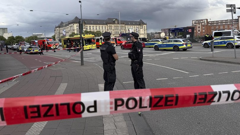 A 39-year-old woman has been detained following a stabbing rampage at Hamburg’s central train station that left seventeen people injured, as police probe motives.
