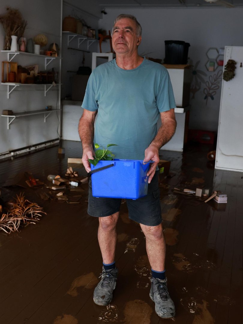 Taree resident Peter Lay cleans up after torrential rain devastated communities across the NSW Mid North Coast. Picture: NewsWire / Scott Calvin