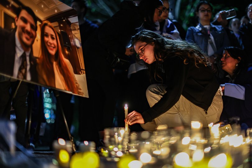 People gather outside the White House on Thursday night during a vigil for Yaron Lischinsky and Sarah Lynn Milgrim. They were shot and killed on Wednesday after attending a “Young Diplomats Reception” hosted by the American Jewish Committee at the Capital Jewish Museum. MUST CREDIT: Valerie Plesch/For The Washington Post