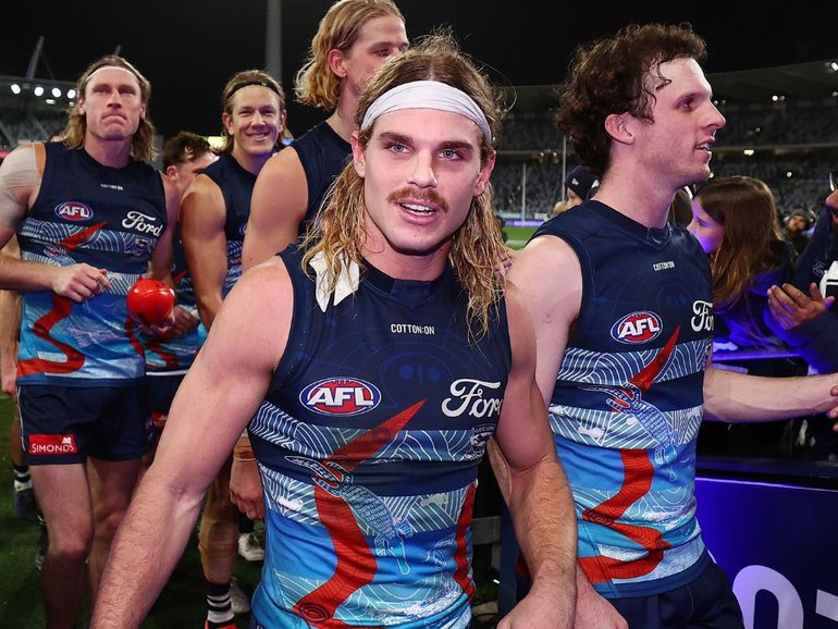 Bailey Smith walks off the field after the win over the Western Bulldogs. 
