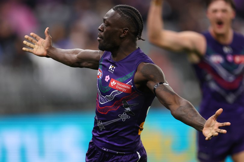 PERTH, AUSTRALIA - MAY 24: Michael Frederick of the Dockers celebrates a goal during the round 11 AFL match between Walyalup (Fremantle Dockers) v Yartapuulti (Port Adelaide Power) at Optus Stadium, on May 24, 2025, in Perth, Australia. (Photo by Paul Kane/Getty Images via AFL Photos)