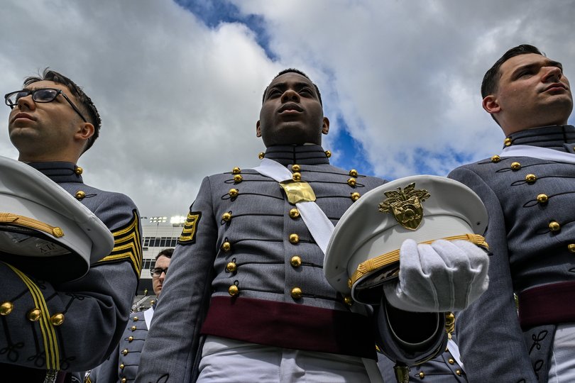 Graduating cadets listen to a commencement address from President Donald Trump.