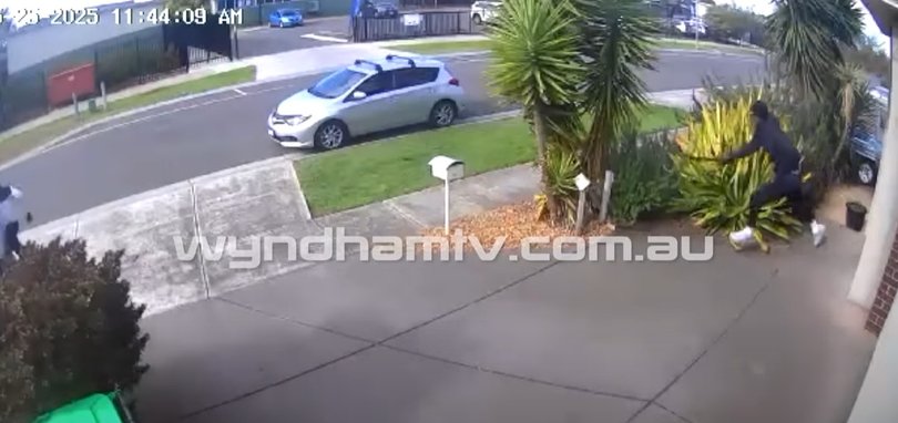 One male was seen holding a bloodied machete after fleeing the scene.