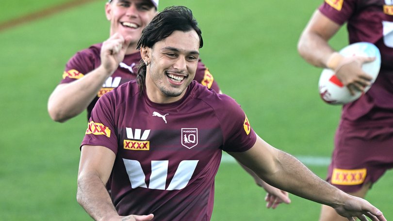 Tino Fa'asuamaleaui shares a laugh with teammates during a Queensland training session.