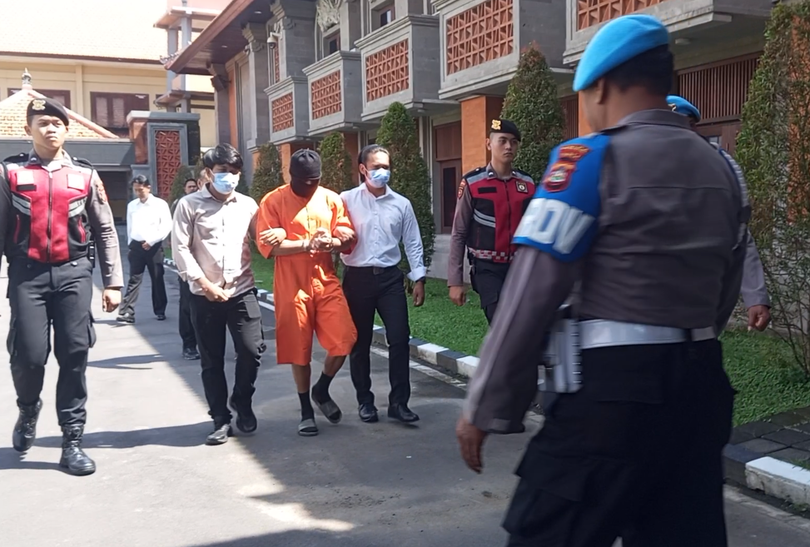 Ahchee was seen in footage being led handcuffed in an orange jumpsuit and a ski mask covering his face. 