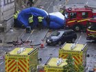 Police and emergency personnel deal with an incident after a car collided with pedestrians near the Liver Building during the Premier League winners parade in Liverpool, England, Monday, May 26, 2025.(AP Photo/Jon Super)