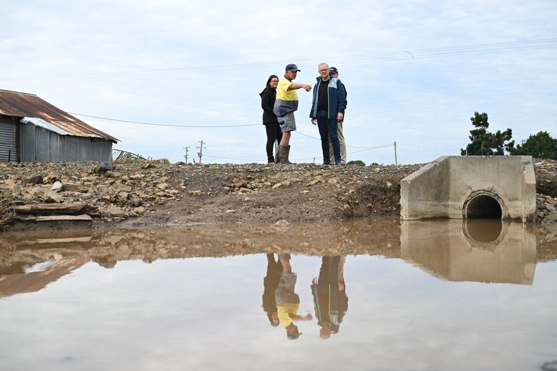 Australian Prime Minister Anthony Albanese is joined by Minister for Emergency Management Kristy McBain as he meets with dairy farmer Milton Johnson during a visit to the flood effected region of Taree, NSW.