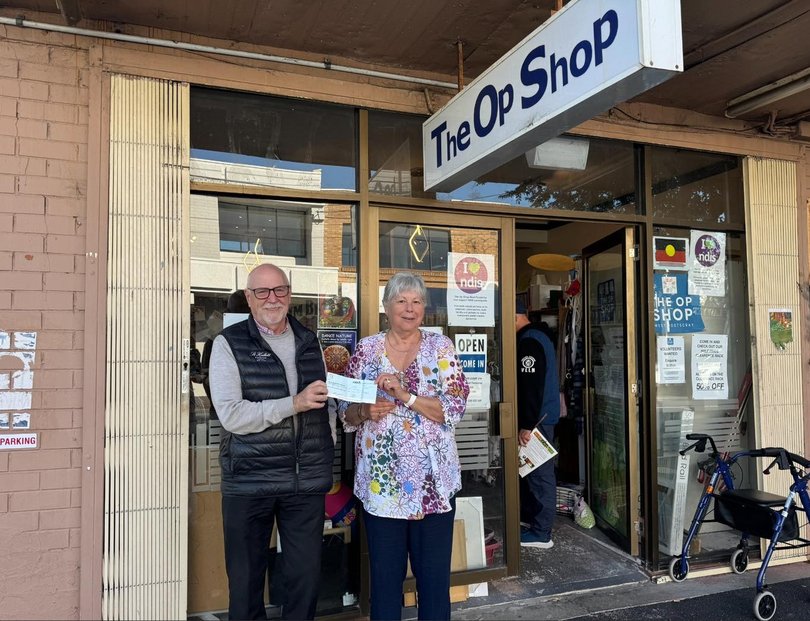 Brendan handing over some very much needed financial support to one of our awesome volunteers Monika.