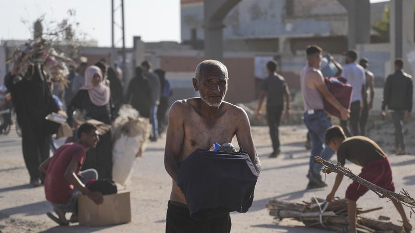 Scenes of Palestinians storming aid centres in Gaza are "heartbreaking" says the UN. (AP PHOTO)