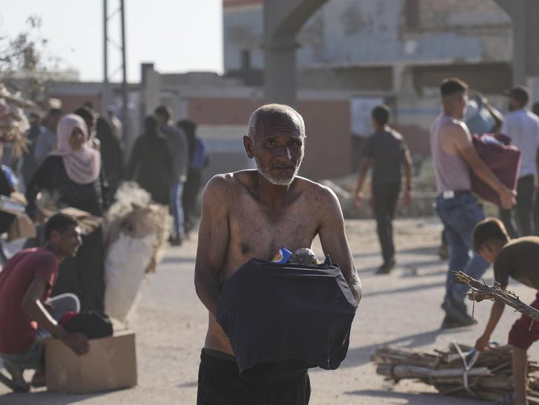 Scenes of Palestinians storming aid centres in Gaza are "heartbreaking" says the UN. (AP PHOTO)