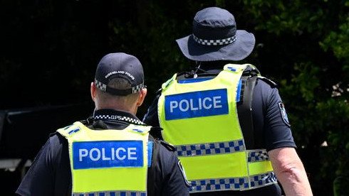 Schools and a hospital have been locked down as police hunt an armed gunman in Queensland.