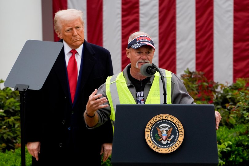 US President Donald Trump, left, and autoworker Brian Pannebecker during the ‘Liberation Day’ tariff announcement on Wednesday, April 2.