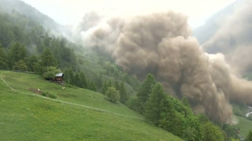 A huge chunk of a glacier in the Swiss Alps broke off on Wednesday, causing a deluge of rock, mud, and ice to bury a mountain village.