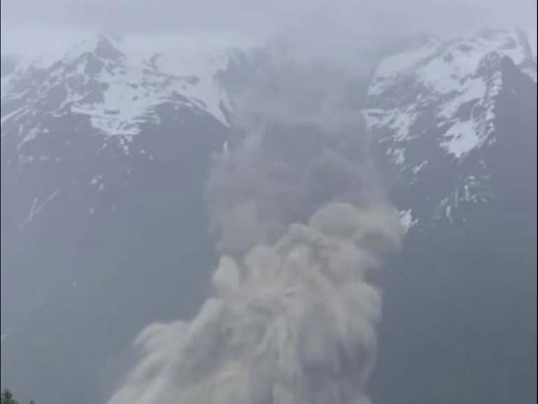 An avalanche from the Birch glacier covers buildings in Blatten, Switzerland, 28 May 2025. A number of houses were destroyed in the village of Blatten, but no casualties have been reported, according to authorities. Unknown