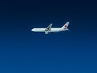 An Air Canada Boeing flying in the deep blue sky. 