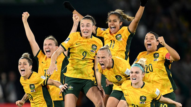 Australia players celebrate their World Cup quarterfinal over France in 2023.