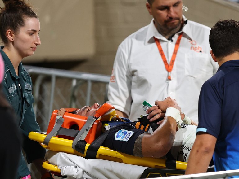 Noah Lolesio is stretchered from the field.