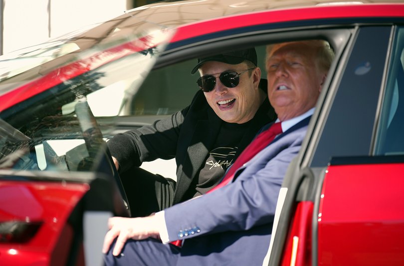 Donald Trump and Elon Musk sit in a Model S on the South Lawn of the White House on March 11, 2025.