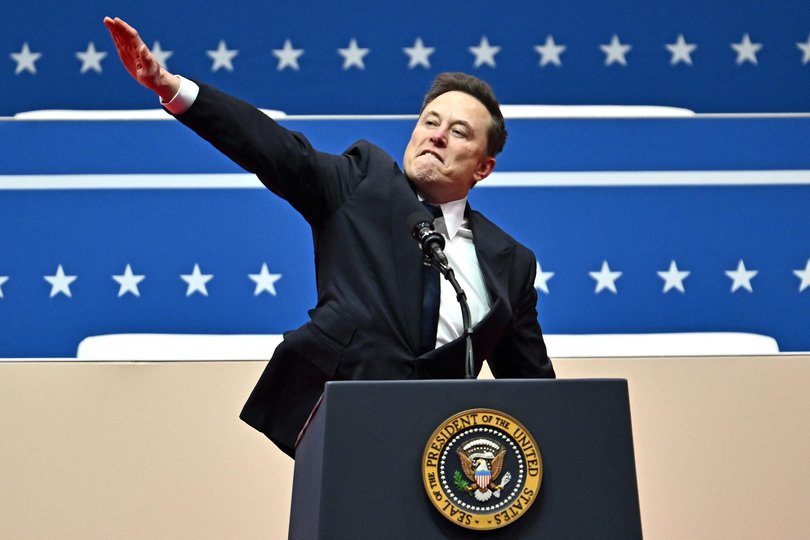 Elon Musk gestures as he speaks during the inaugural parade inside Capitol One Arena, in Washington, DC, on January 20, 2025.