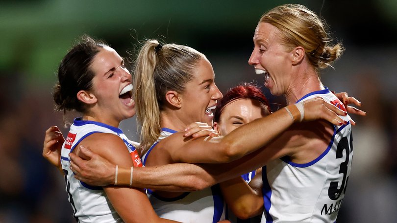 Bella Eddey, Alice O'Loughlin, Jenna Bruton and Kate Shierlaw celebrate during the 2024 AFLW grand final.