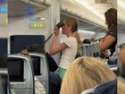 A video of a teenage girl's impromptu mid-flight performance has taken social media by storm.