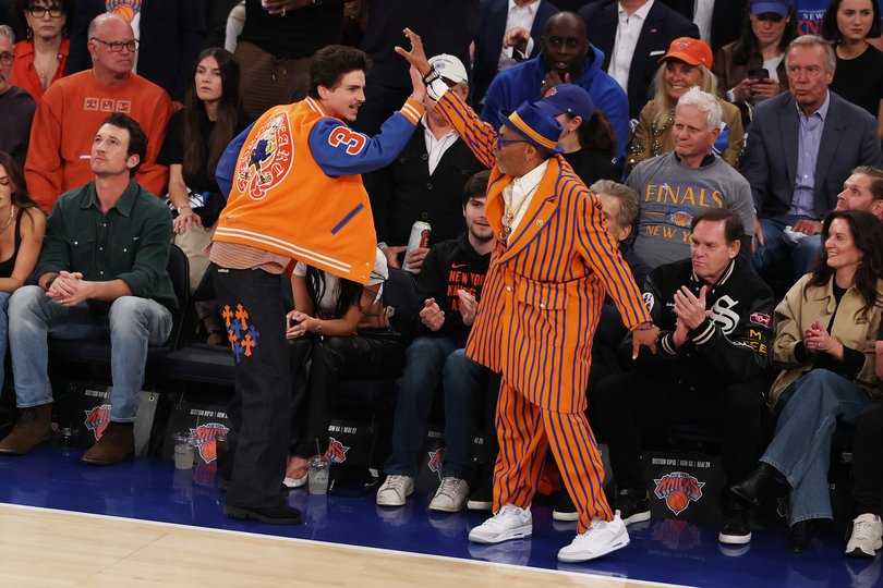Timothee Chalamet and Spike Lee high five.