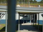 A woman accused of fatally stabbing her young child has been rushed from detention to hospital.