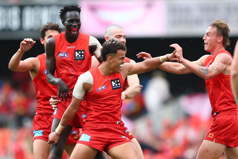 GOLD COAST, AUSTRALIA - MAY 31: Leo Lombard of the Suns celebrates with team mates after kicking a goal during the round 12 AFL match between Gold Coast Suns and Fremantle Dockers at People First Stadium, on May 31, 2025, in Gold Coast, Australia. (Photo by Chris Hyde/Getty Images via AFL Photos)