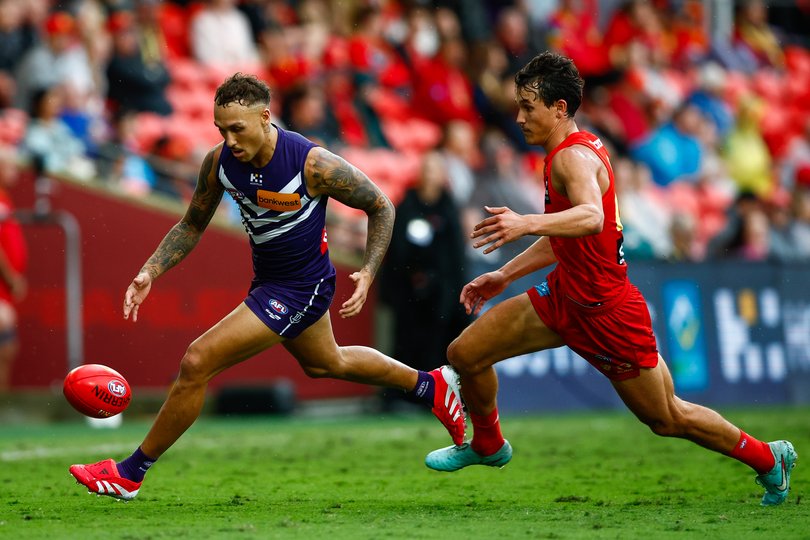 GOLD COAST, AUSTRALIA - MAY 31: Shai Bolton of the Dockers and Wil Powell of the Suns compete for the ball during the 2025 AFL Round 12 match between the Gold Coast Suns and the Fremantle Dockers at People First Stadium on May 31, 2025 in the Gold Coast, Australia. (Photo by Russell Freeman/AFL Photos)