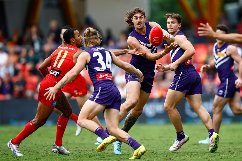 GOLD COAST, AUSTRALIA - MAY 31: Luke Jackson of the Dockers handpasses the ball during the 2025 AFL Round 12 match between the Gold Coast Suns and the Fremantle Dockers at People First Stadium on May 31, 2025 in the Gold Coast, Australia. (Photo by Russell Freeman/AFL Photos)
