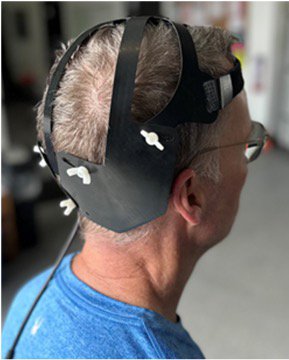 A participant wears a LED helmet in the Parkinson’s disease red light therapy trial.
