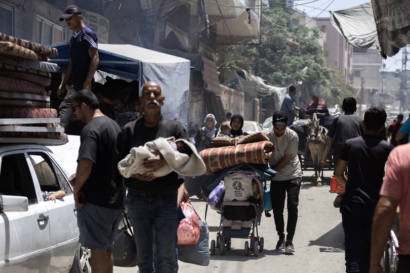 Palestinians in Jabalia flee on Friday, May 30, 2025, after the Israeli military issued a sweeping new evacuation order for much of northern Gaza.