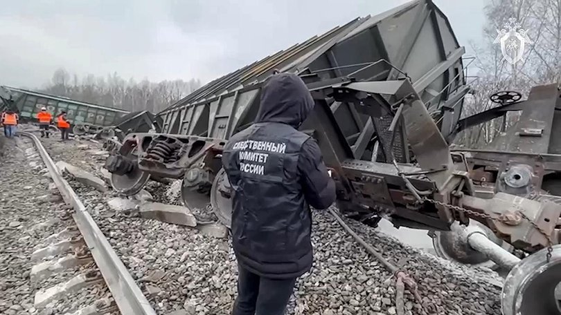 A passenger train has derailed in western Russia after a bridge collapsed, killing seven people.